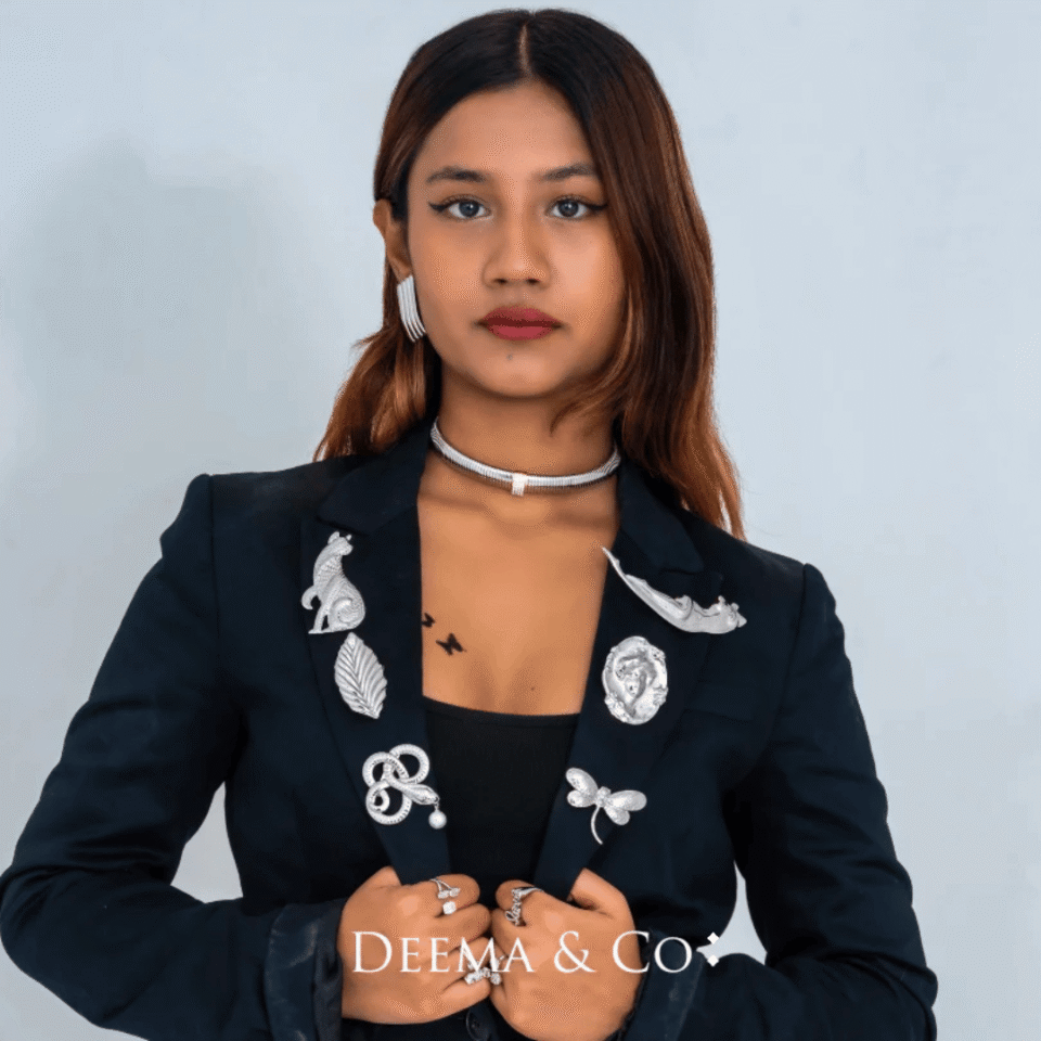 Model wearing hypoallergenic water safe tarnish-free brooches on blazer