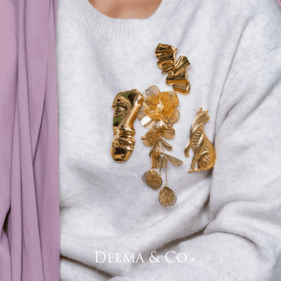 Model wearing water safe tarnish-free hypoallergenic stainless steel plating brooches